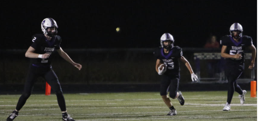 Landon Feit intercepts a pass against GCMS while Keaton Malcom and Noah Henderson block.
