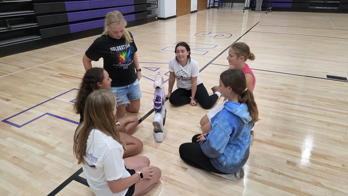 Senior Hannah Kurz leads underclassmen student council members in a icebreaker activity (building a shoe tower) at the beginning of the year.
