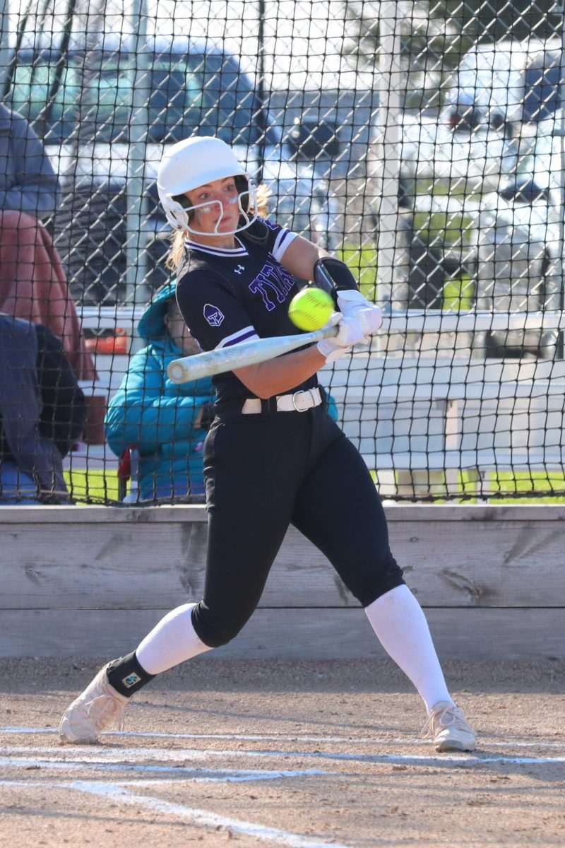 Senior Tori Seggerman rips a hit for the Titan softball team.
