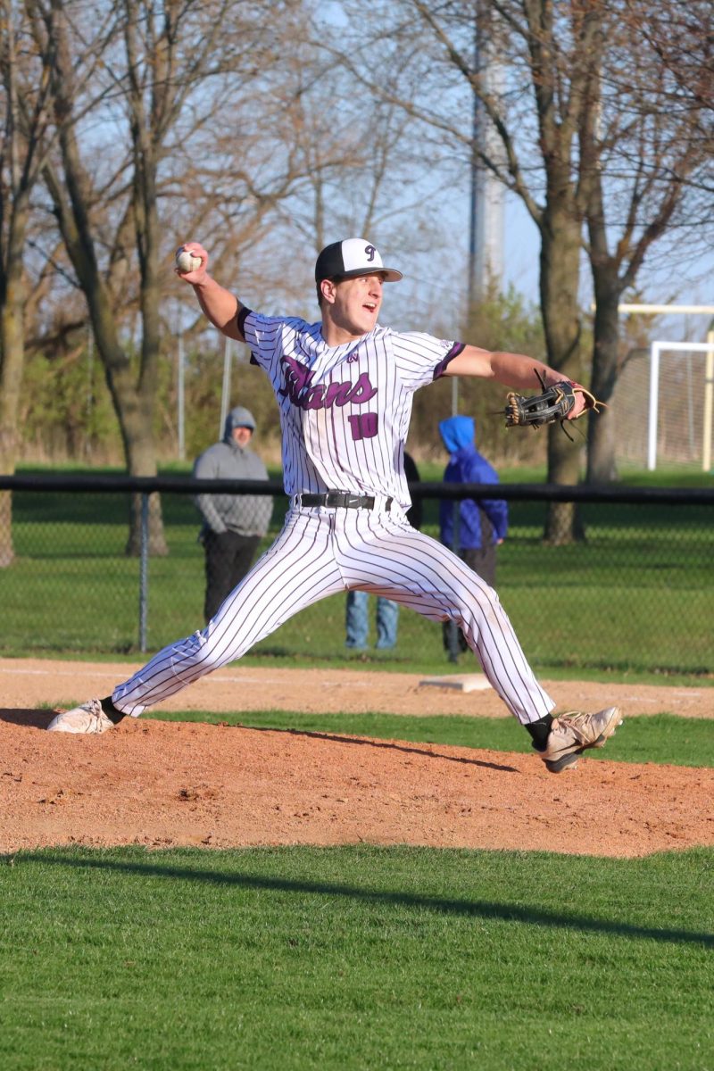 Junior Owen Adams pitches for the Titans.