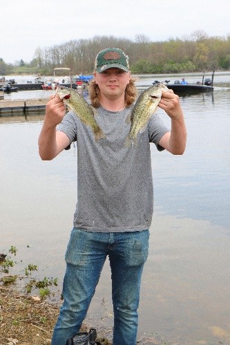 Senior Zeke Gaddy holds up a couple of his catches during a tournament last year. 